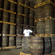 Jose Fundora, 55, looks to a colleague (not pictured) as he counts barrels of rum at a cellar of the Havana Club Distillery in San Jose de las Lajas, Cuba, May 12, 2015. Picture taken May 12, 2015.